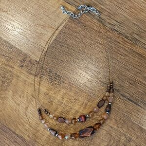 Necklace with assorted shades of brown beads